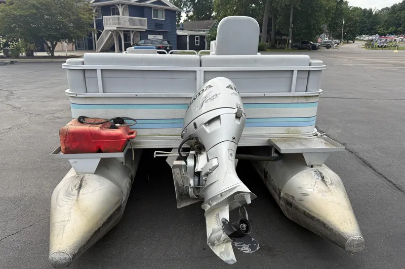 Slide: The Image of 1989 Riviera Cruiser Fun Deck 22 pontoon boat with outboard motor and fuel tank. - 5