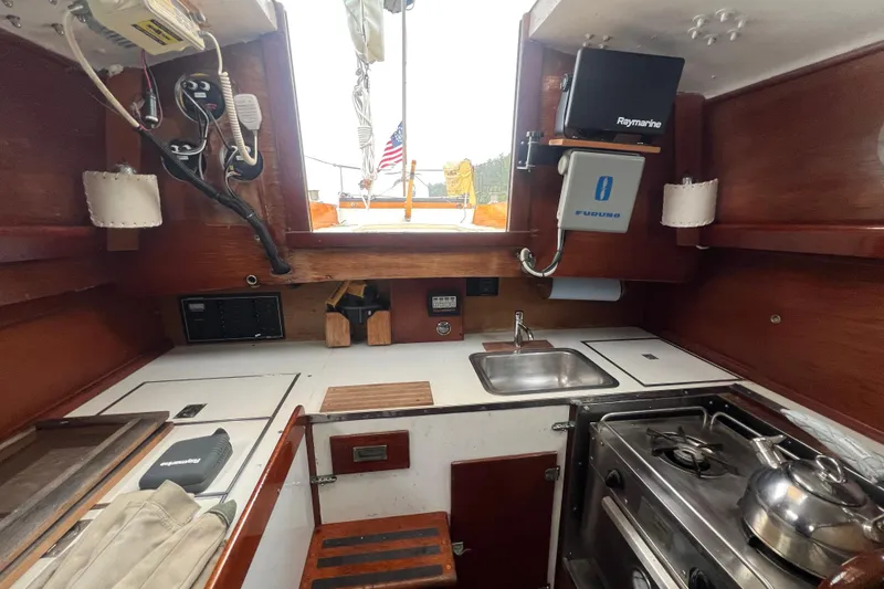 Slide: The Image of Interior of 1964 Hinckley Pilot 35 Sloop with kitchen and navigation equipment. - 4