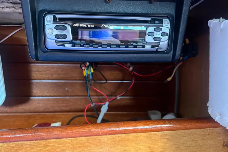 Slide: The Image of Hinckley Pilot 35 Sloop 1964 interior with Pioneer stereo system and visible wiring. - 7