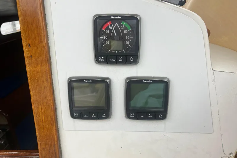 Slide: The Image of Hinckley Pilot 35 Sloop 1964 with Raymarine navigation instruments on wooden panel. - 11