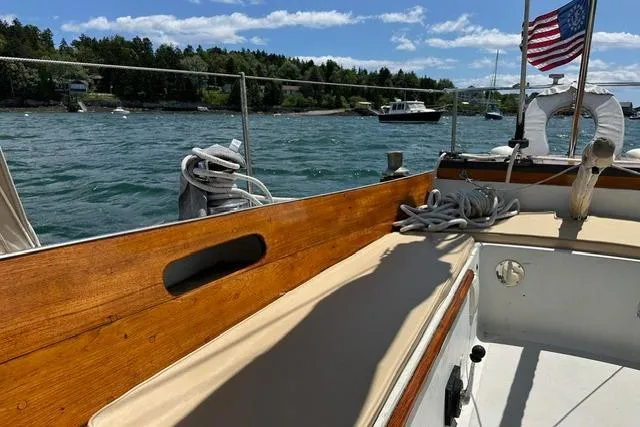 Slide: The Image of 1964 Hinckley Pilot 35 Sloop sailing on a sunny day with American flag. - 24