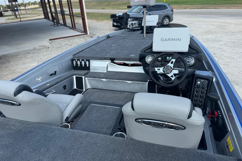 Slide: The Image of 2026 Phoenix 721 ZXL boat interior with Garmin navigation system and dual seating. - 7