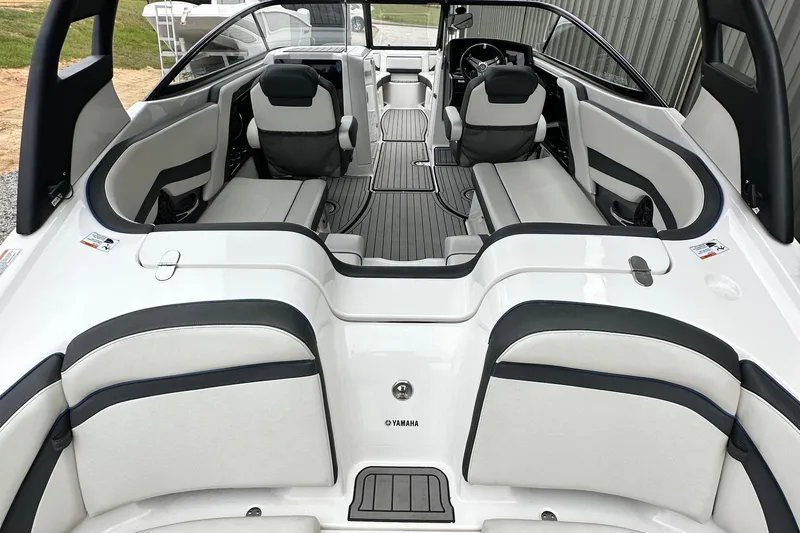 Slide: The Image of 2018 Yamaha Boats 242 Limited S E-Series interior with sleek seating and modern design. - 10