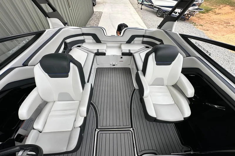Slide: The Image of 2018 Yamaha Boats 242 Limited S E-Series interior with sleek seating and modern design. - 11
