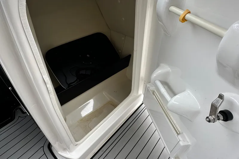 Slide: The Image of 2018 Yamaha Boats 242 Limited S E-Series interior storage compartment. - 12