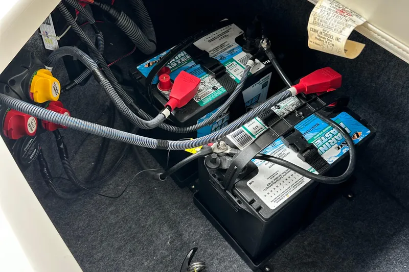 Slide: The Image of Battery compartment of 2018 Yamaha Boats 242 Limited S E-Series with wiring connections. - 14
