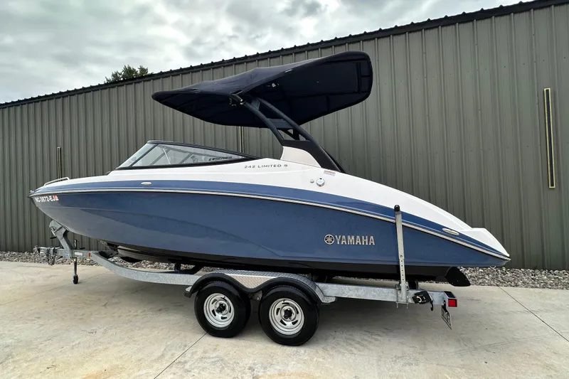 Slide: The Image of 2018 Yamaha 242 Limited S E-Series boat on trailer, parked outdoors. - 3