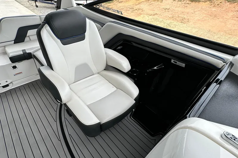 Slide: The Image of 2018 Yamaha Boats 242 Limited S E-Series interior with sleek captain's chair and modern design. - 7
