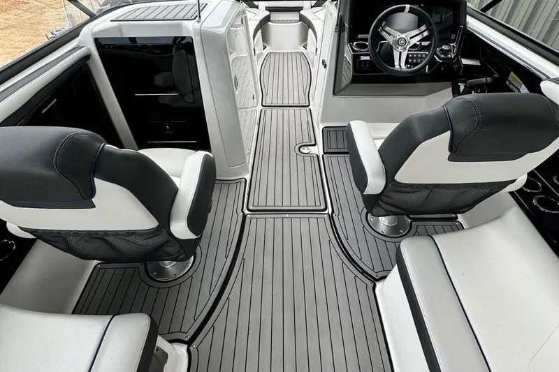 Slide: The Image of 2018 Yamaha Boats 242 Limited S E-Series interior with sleek seating and modern dashboard. - 8