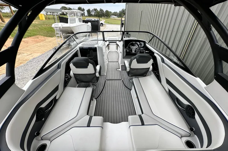 Slide: The Image of 2018 Yamaha Boats 242 Limited S E-Series interior with sleek seating and modern dashboard. - 9