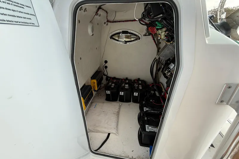 Slide: The Image of Interior view of 2020 Twin Vee 240 GFX CC boat's battery compartment. - 20