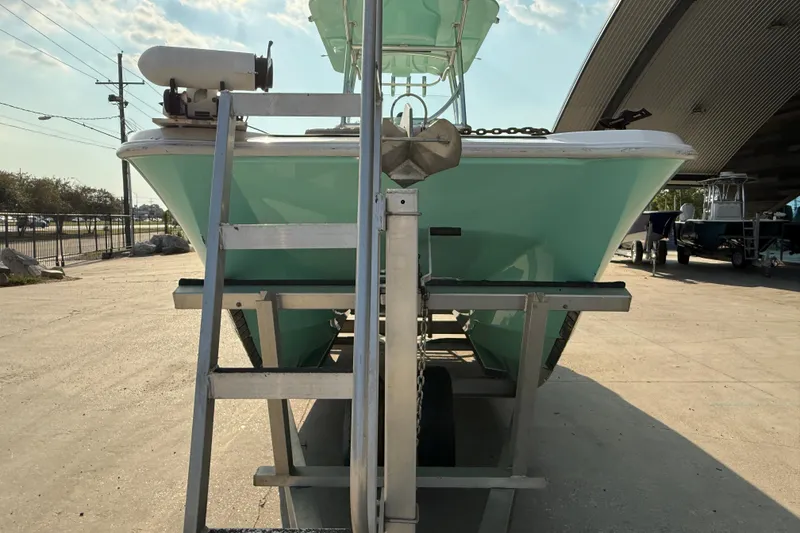 Slide: The Image of 2020 Twin Vee 240 GFX CC boat on trailer, viewed from front, outdoors. - 3