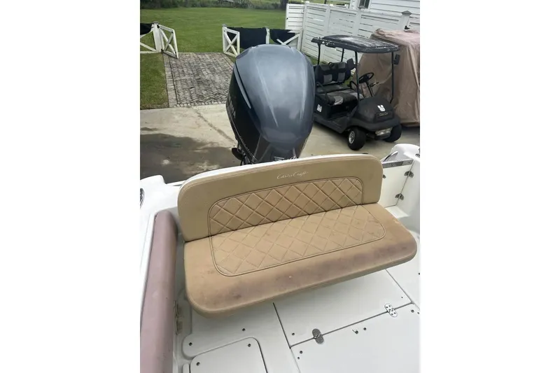 Slide: The Image of 2016 Chris-Craft Catalina 23 boat with tan seating and outboard motor. - 10