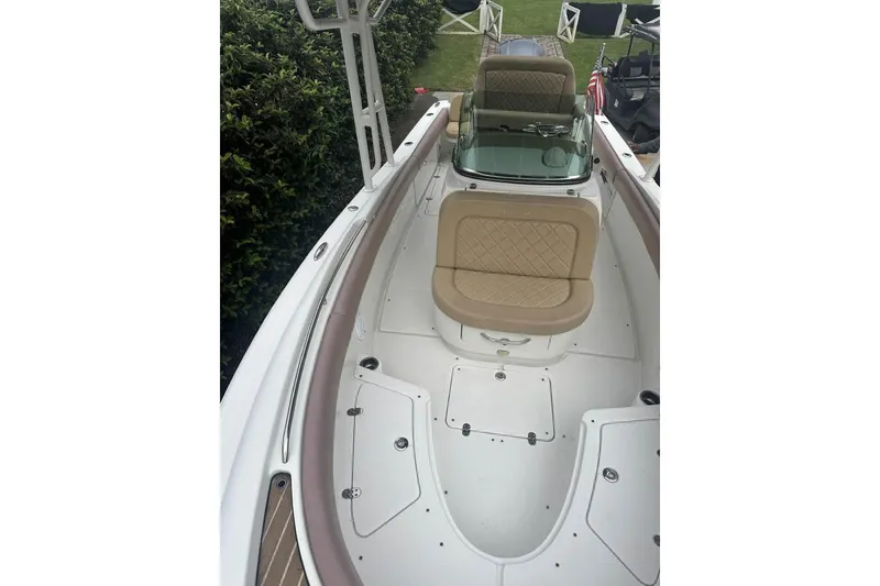 Slide: The Image of 2016 Chris-Craft Catalina 23 boat interior with tan seating and sleek design. - 11