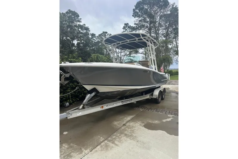 Slide: The Image of 2016 Chris-Craft Catalina 23 boat on trailer, parked outdoors. - 12
