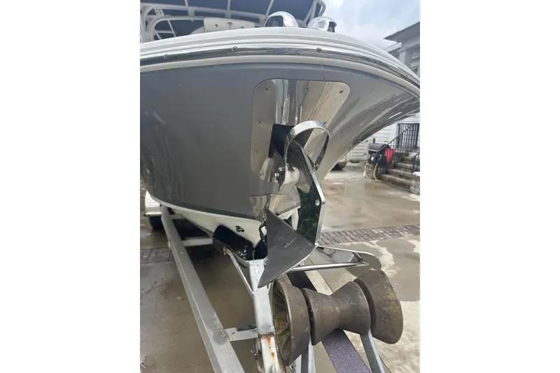 Slide: The Image of 2016 Chris-Craft Catalina 23 boat on trailer, showcasing anchor and hull details. - 6