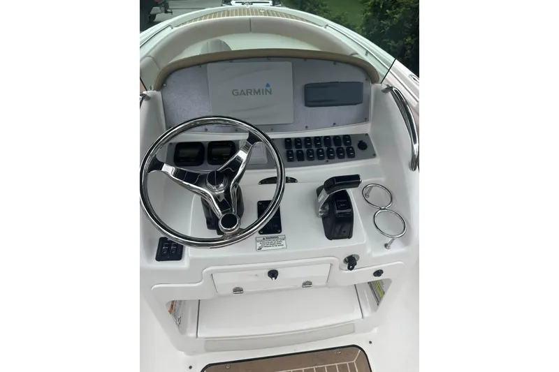 Slide: The Image of 2016 Chris-Craft Catalina 23 helm with Garmin display and chrome steering wheel. - 8