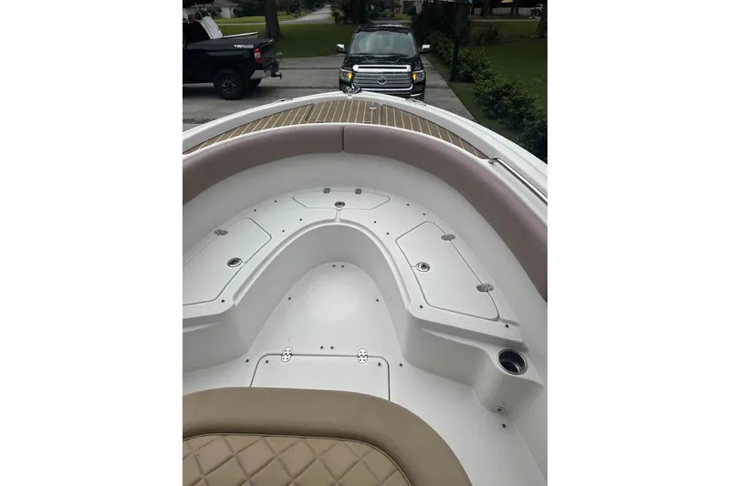 Slide: The Image of 2016 Chris-Craft Catalina 23 boat interior with seating and storage compartments. - 9