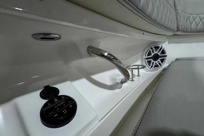 Slide: The Image of 2026 Pursuit DC 326 Dual Console interior with audio controls and speaker. - 16