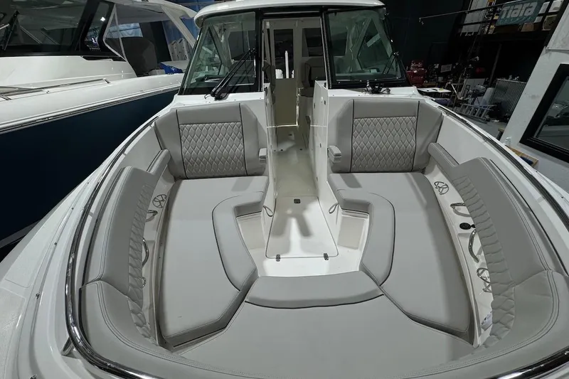 Slide: The Image of 2026 Pursuit DC 326 Dual Console boat interior with luxurious seating and modern design. - 20
