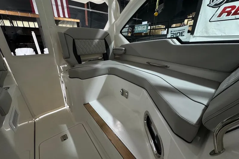 Slide: The Image of 2026 Pursuit DC 326 Dual Console interior with sleek seating and modern design. - 22