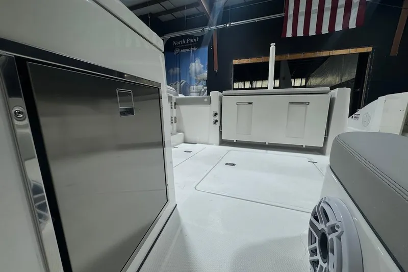 Slide: The Image of 2026 Pursuit DC 326 Dual Console boat interior with sleek design and modern amenities. - 23