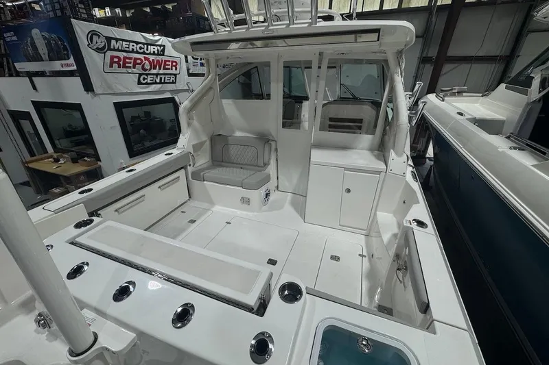 Slide: The Image of 2026 Pursuit DC 326 Dual Console boat interior at Mercury Repower Center. - 28