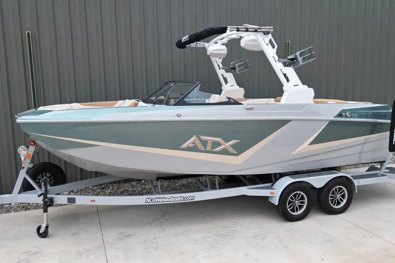 The Image of 2026 ATX Surf Boats 22 Type-S on trailer, sleek design, green and white color scheme. - 0