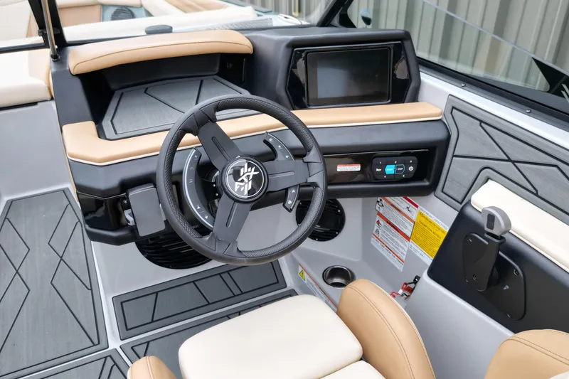 Slide: The Image of 2026 ATX Surf Boats 22 Type-S dashboard with steering wheel and touchscreen display. - 11