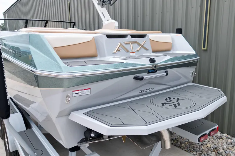 Slide: The Image of 2026 ATX Surf Boats 22 Type-S, rear view, featuring swim platform and sleek design. - 13