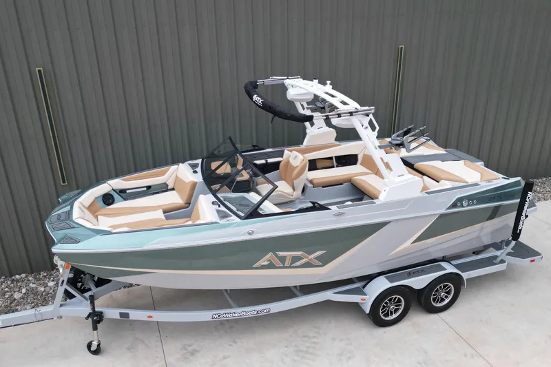 Slide: The Image of 2026 ATX Surf Boats 22 Type-S on trailer, sleek design, green and white color scheme. - 5