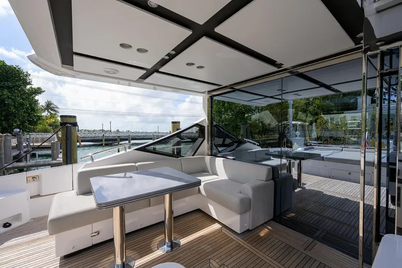 Slide: The Image of 2019 Azimut S7 yacht with modern outdoor seating area and waterfront view. - 15
