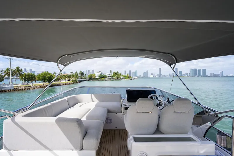 Slide: The Image of 2019 Azimut S7 yacht with spacious deck and city skyline view. - 18