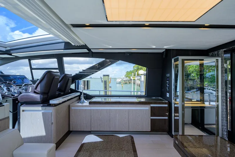 Slide: The Image of Interior of 2019 Azimut S7 yacht with modern design and waterfront view. - 29