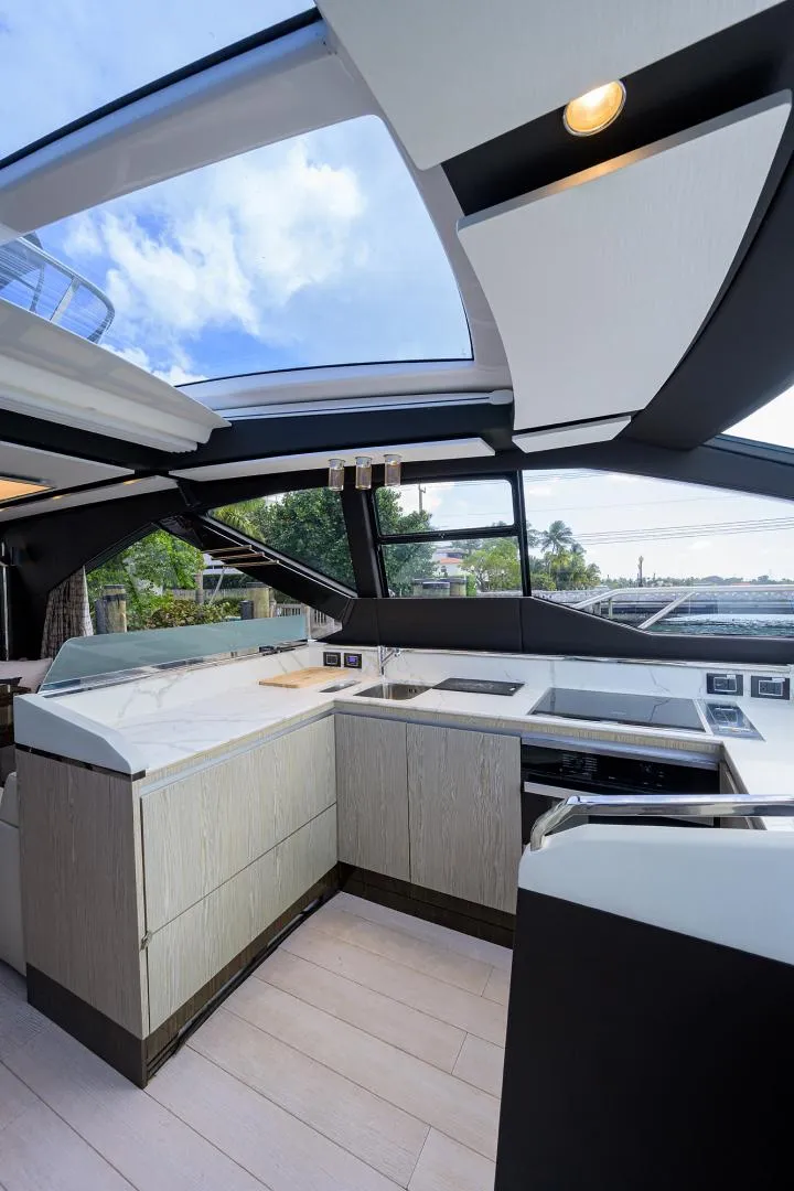 Slide: The Image of Modern kitchen interior of 2019 Azimut S7 yacht with panoramic windows and sleek design. - 34