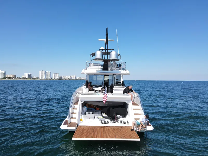 Slide: The Image of 2019 Azimut S7 yacht on open water with city skyline in background. - 4