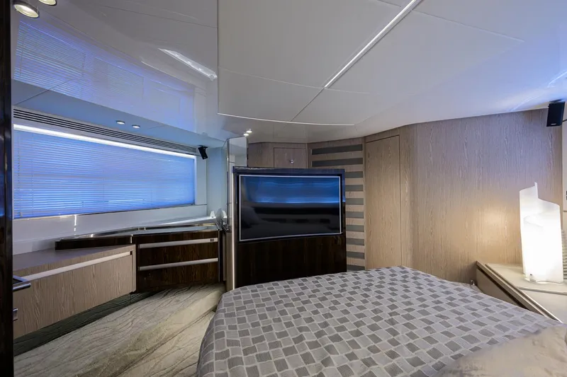 Slide: The Image of Luxurious bedroom interior of 2019 Azimut S7 yacht with modern furnishings and large TV. - 40