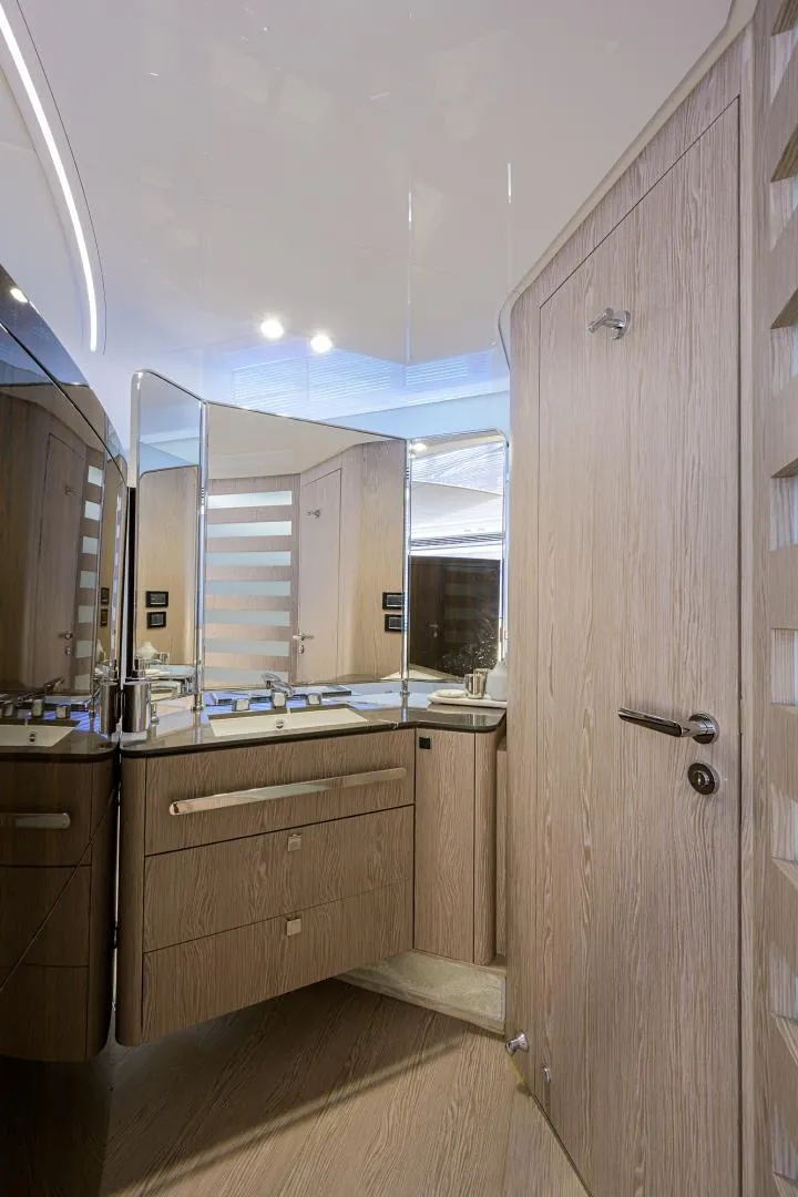 Slide: The Image of 2019 Azimut S7 yacht bathroom with modern fixtures and wooden cabinetry. - 41
