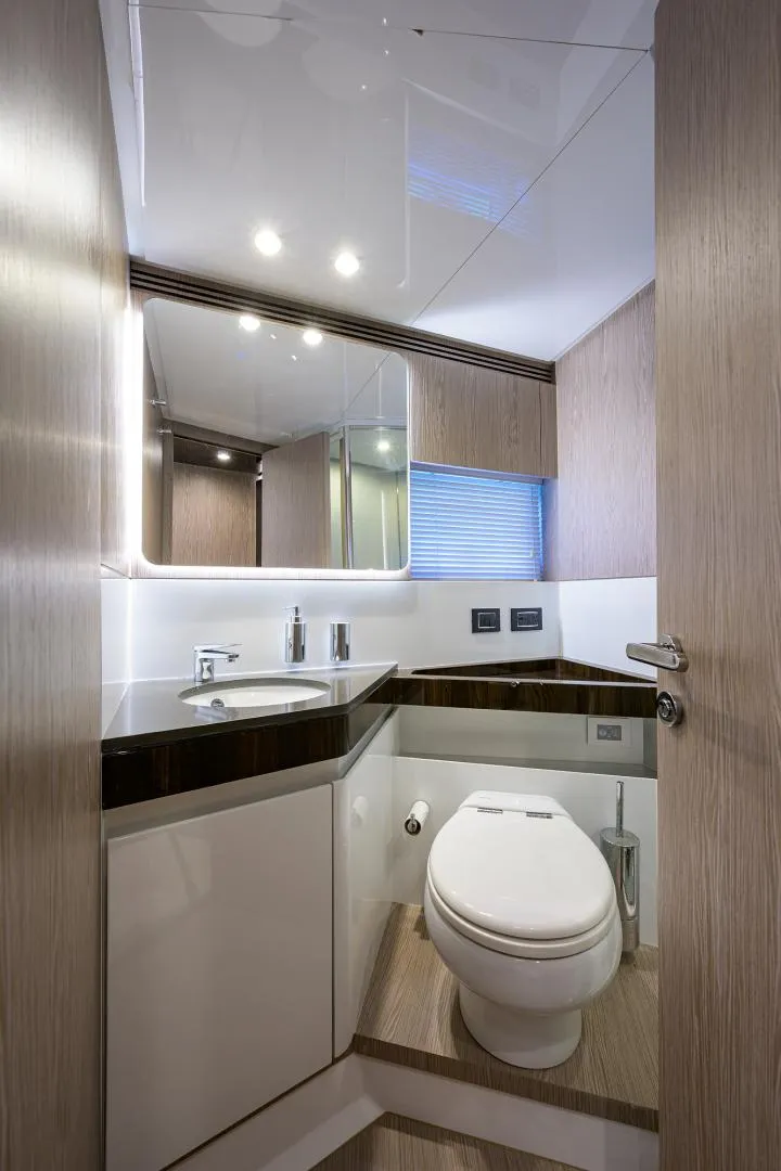 Slide: The Image of Modern bathroom in 2019 Azimut S7 yacht with sleek fixtures and wooden accents. - 43