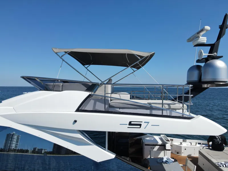 Slide: The Image of 2019 Azimut S7 luxury yacht docked with clear blue sky and ocean background. - 8