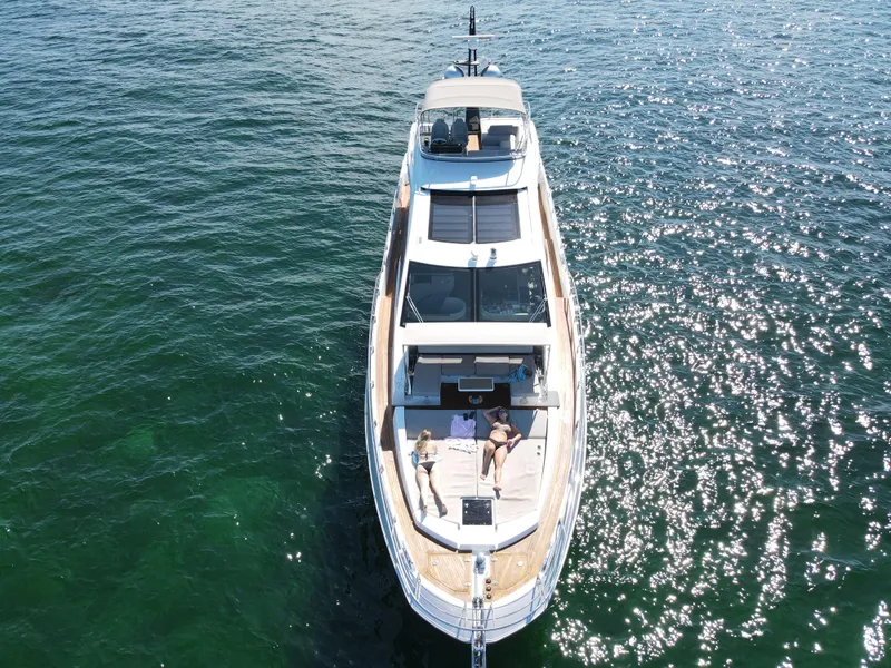 Slide: The Image of Aerial view of a 2019 Azimut S7 yacht cruising on the water. - 9