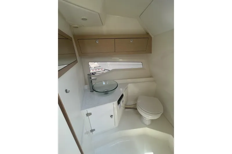 Slide: The Image of Interior of 2022 Parker Poland 850 Voyager boat bathroom with modern fixtures. - 7