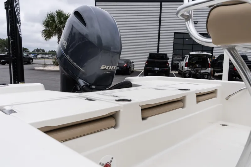 Slide: The Image of 2020 NauticStar 215 XTS boat with Yamaha 200 engine in parking lot. - 7