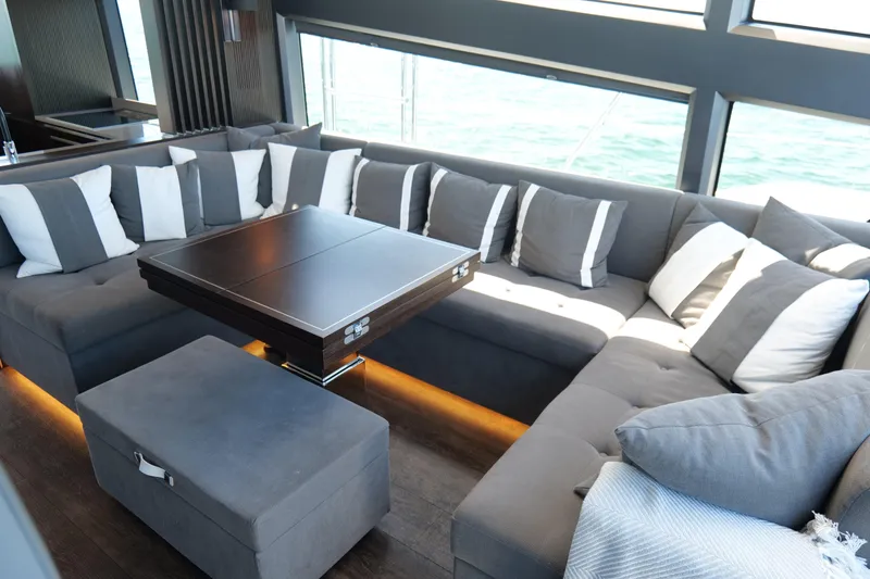 Slide: The Image of Luxurious interior of 2022 Pearl 62 yacht with elegant seating and ocean view. - 17