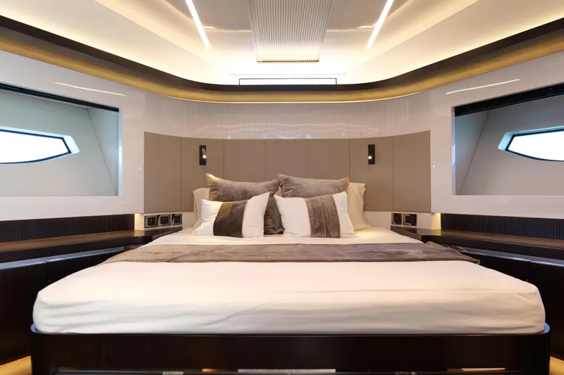 Slide: The Image of Luxurious bedroom interior of 2022 Pearl 62 yacht with modern design and elegant lighting. - 33