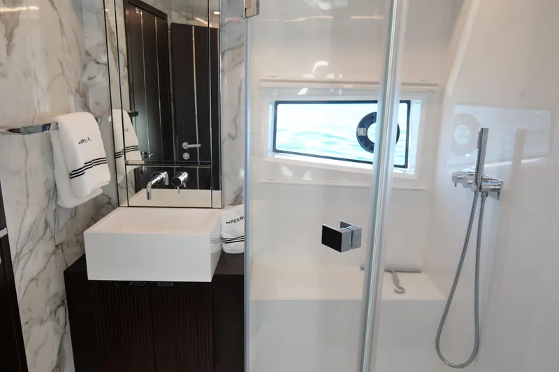 Slide: The Image of Luxurious bathroom in 2022 Pearl 62 yacht with modern fixtures and marble accents. - 37