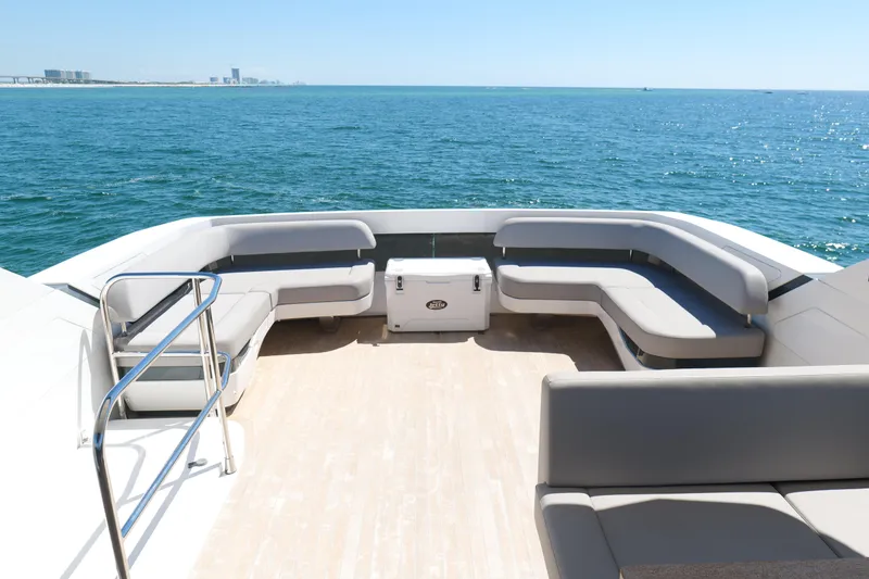 Slide: The Image of Luxurious 2022 Pearl 62 yacht deck with seating, overlooking serene ocean view. - 44