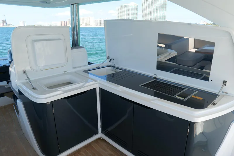 Slide: The Image of Outdoor kitchen on 2022 Pearl 62 yacht with ocean view and modern amenities. - 48