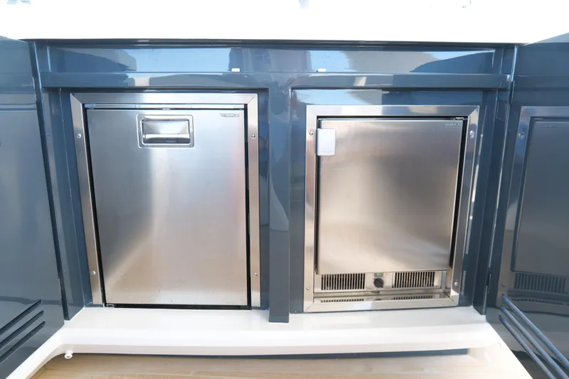 Slide: The Image of Stainless steel appliances on a 2022 Pearl 62 yacht, featuring sleek modern design. - 49