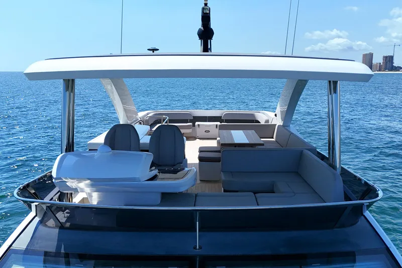 Slide: The Image of Luxurious 2022 Pearl 62 yacht with spacious deck and seating on open sea. - 52